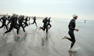 090329-N-2959L-169 CORONADO, Calif. (March 29, 2009) Athletes race to the water to begin the swim portion of the 31st annual Superfrog Triathlon at Silver Strand State Beach. Superfrog is a long distance, circuit-style triathlon that features a 1.2-mile open-ocean swim, 56-mile bike ride and 13.1-mile run and is considered one of the toughest triathlons in the U.S. Superfrog is held concurrently with Superseal, another triathlon that consists of a 1.5-km bay swim, 40-km bike race and 10-km run. Proceeds from both events will benefit the Naval Special Warfare Foundation, a non-profit organization that supports Naval Special Warfare service members and their families in times of need. (U.S. Navy photo by Mass Communication Specialist 2nd Class Dominique M. Lasco/Released)